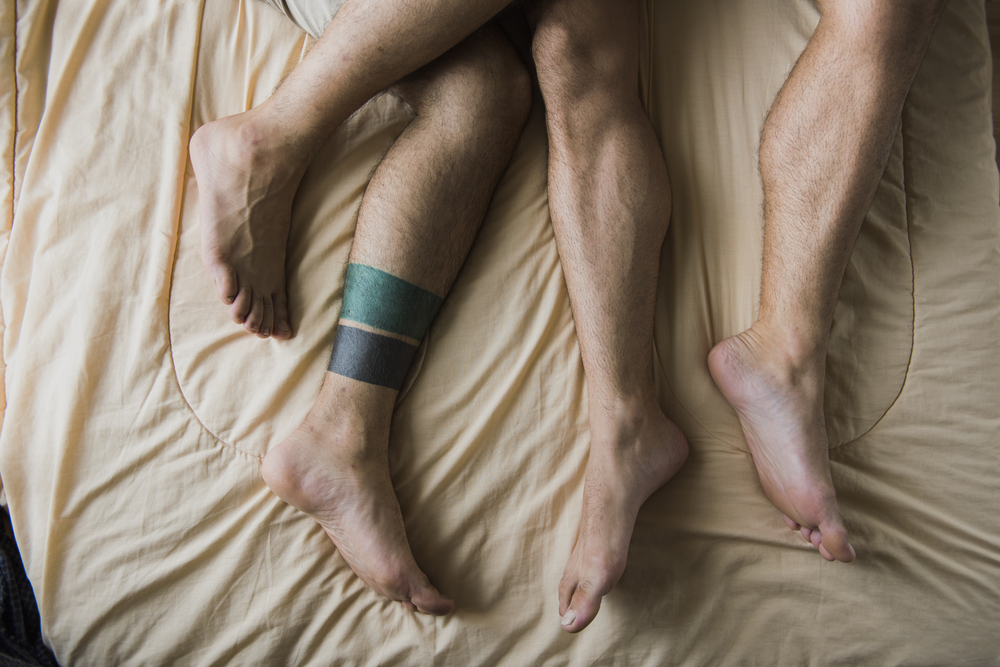 gay men in bed with foot fetish